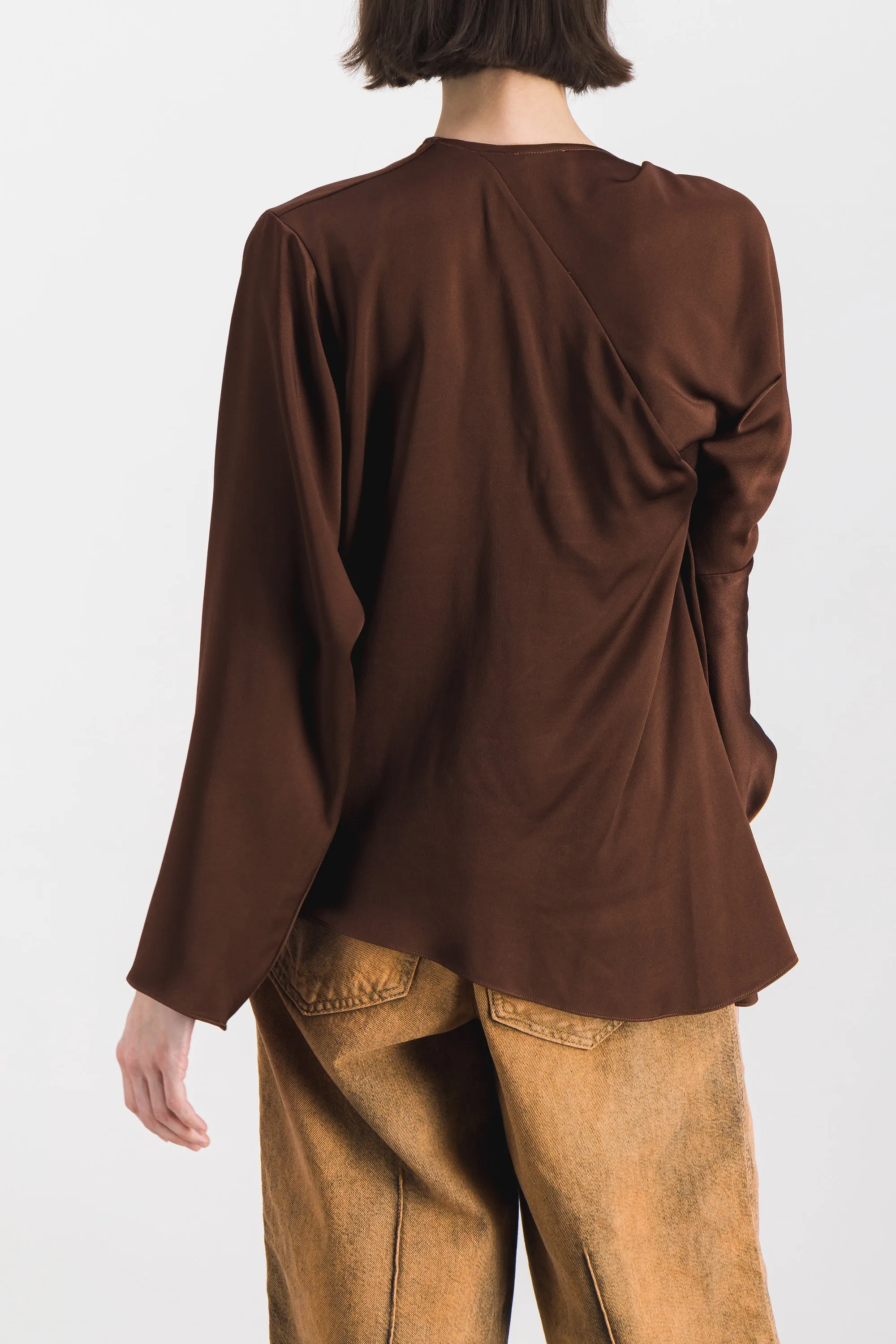 Asymmetric draped crêpe satin long sleeved top