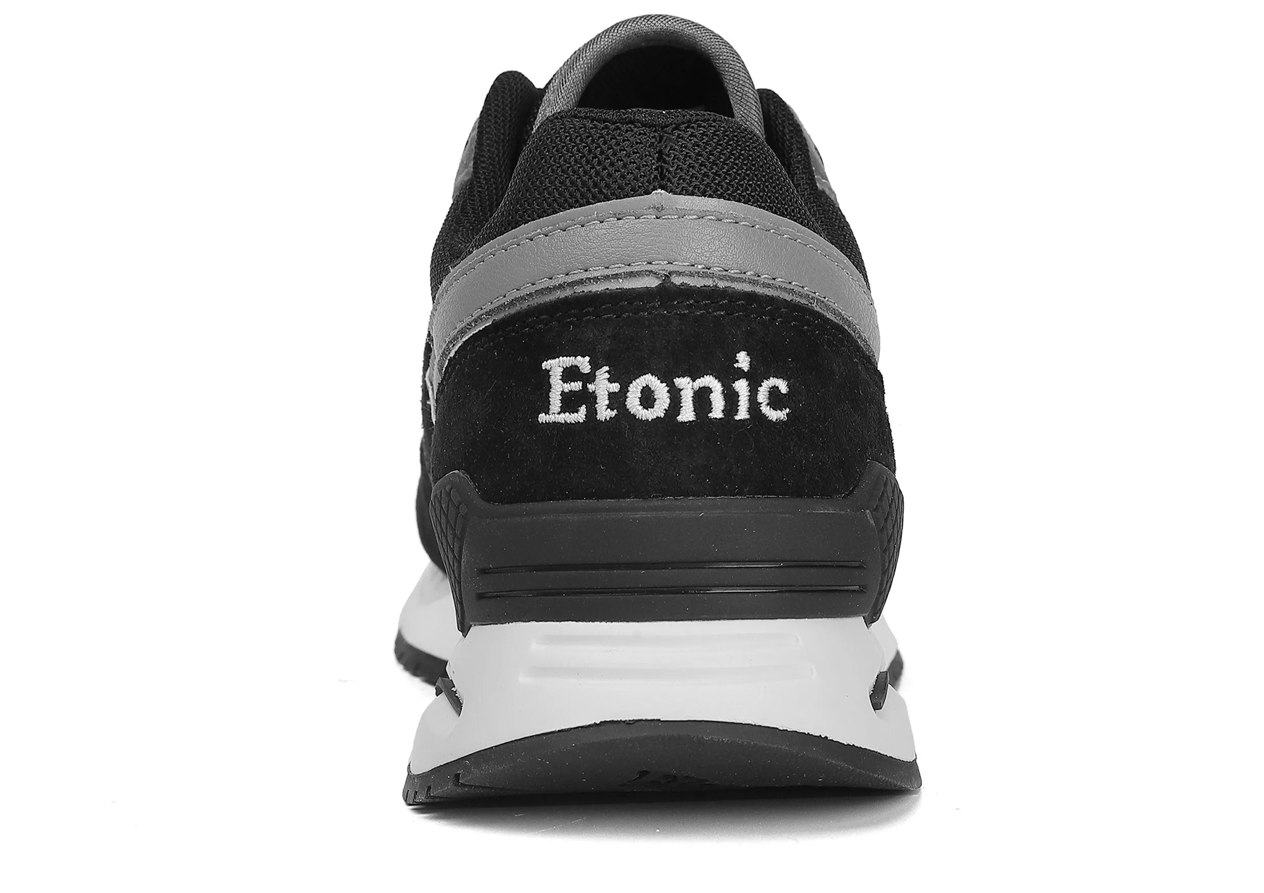 Etonic Stable Base sneakers in black nubuck, tonal mesh fabric, black suede with multi-layer dark grey leather inserts, white midsole and black bottom outsole.