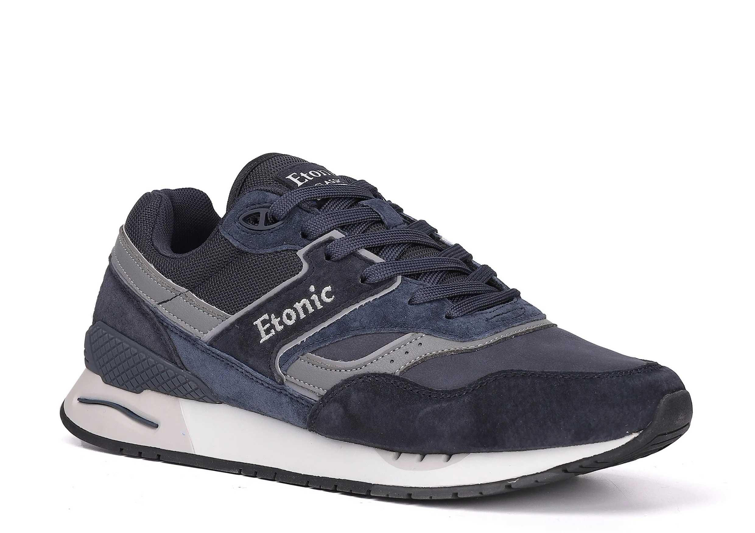 Etonic Stable Base sneakers in dark blue nubuck, tonal mesh fabric, dark blue suede with multi-layer grey leather inserts, white midsole and dark blue bottom outsole.