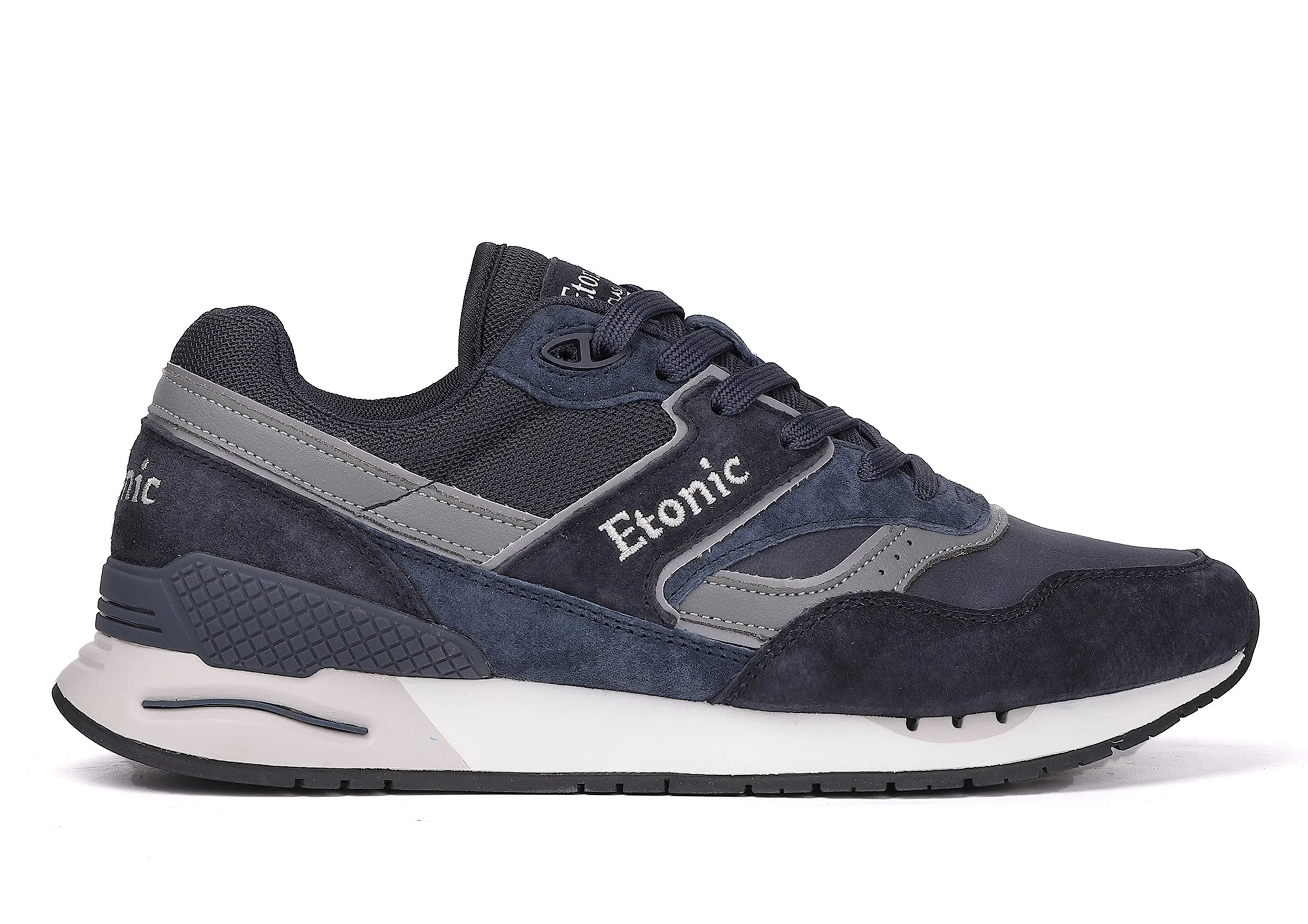 Etonic Stable Base sneakers in dark blue nubuck, tonal mesh fabric, dark blue suede with multi-layer grey leather inserts, white midsole and dark blue bottom outsole.